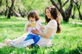 Happy family on picnic for mothers day. Mom and toddler son eating sweets outdoor in spring or summer Royalty Free Stock Photo