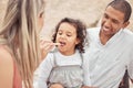 Happy family picnic in nature mom feeding child and dad smiling. Man, woman and small girl spend time together outdoors Royalty Free Stock Photo