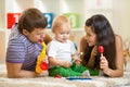 Happy family play musical toys Royalty Free Stock Photo