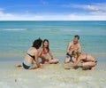 Happy family playing at the beach Royalty Free Stock Photo