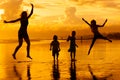 Happy family playing at the beach Royalty Free Stock Photo
