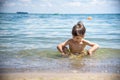 Happy family playing in blue water of swimming pool on a tropical resort at the sea. Summer vacations concept. Two brother kids Royalty Free Stock Photo