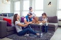 Happy family playing board games at home. Royalty Free Stock Photo
