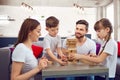 Happy family playing board games at home. Royalty Free Stock Photo