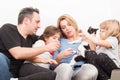 Happy family playing with cat or pet Royalty Free Stock Photo