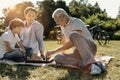 Happy family playing chess in nature Royalty Free Stock Photo