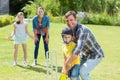 Happy family playing cricket together Royalty Free Stock Photo