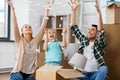 Happy family playing with foam peanuts at new home Royalty Free Stock Photo