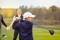 Happy family is playing golf in autumn Royalty Free Stock Photo