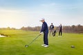 Happy family is playing golf in autumn Royalty Free Stock Photo