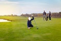 Happy family is playing golf in autumn Royalty Free Stock Photo