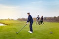 Happy family is playing golf in autumn Royalty Free Stock Photo