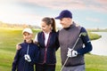 Happy family is playing golf in autumn Royalty Free Stock Photo