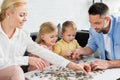 happy family playing with puzzle pieces Royalty Free Stock Photo