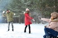 Happy family playing snowballs Royalty Free Stock Photo