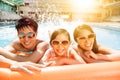 Happy family playing in swimming pool