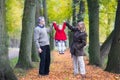 Happy family playing with toddler girl in autumn park Royalty Free Stock Photo