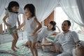 Happy family playing together on the bed Royalty Free Stock Photo