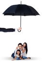 Happy family playing under umbrella in studio Royalty Free Stock Photo