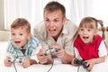 Happy family playing a video game Royalty Free Stock Photo