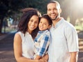 Happy family portrait, boy kid and parents at park outdoors for love, relax and fun walk together in Portugal. Smile mom Royalty Free Stock Photo