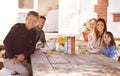 Happy family, portrait and breakfast in garden of home for nutrition, bonding or relax together with porridge. Parents Royalty Free Stock Photo