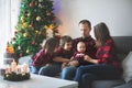 Happy family portrait on Christmas, mother, father and three chi