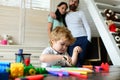 Happy family portrait having fun together. Father mother and child son drawing. Kid learning painting, little artist