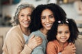 Happy family, portrait and hug by girl with mother and grandmother on sofa, smile and sweet on blurred background. Face Royalty Free Stock Photo