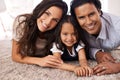 Happy family, portrait and lying on floor for love, bonding or care together at home. Face of mother, father and little Royalty Free Stock Photo