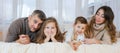 Happy family portrait. Mother father their son and daughter are playing Royalty Free Stock Photo