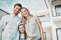 Happy family, portrait and outdoor real estate of new home loan, luxury house and building mortgage in Sweden. Parents Royalty Free Stock Photo