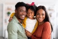 Happy Family. Portrait Of Smiling Black Parents And Their Cute Little Daughter Royalty Free Stock Photo