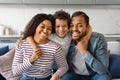 Happy Family Portrait. Smiling black parents and their little son posing together Royalty Free Stock Photo