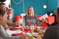 Happy family praying before having Christmas dinner at home Royalty Free Stock Photo