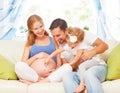 Happy family. pregnant mother, father, and child daughter at hom Royalty Free Stock Photo