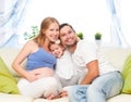 happy family. pregnant mother, father, and child daughter at home Royalty Free Stock Photo