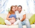 happy family. pregnant mother, father, and child daughter at home Royalty Free Stock Photo