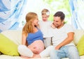 happy family. pregnant mother, father, and child daughter at home Royalty Free Stock Photo