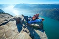 Happy family on Preikestolen massive cliff top (Norway)