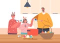 Happy Family Prepare for Easter Spring Holiday Celebration. Father and Daughter with Son in Rabbit Ears Painting Eggs Royalty Free Stock Photo