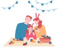 Happy Family Prepare for Easter Spring Holiday Celebration. Mother, Father and Daughter in Rabbit Ears Painting Eggs Royalty Free Stock Photo