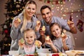 Happy family preparing Christmas biscuits Royalty Free Stock Photo