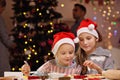 Happy family preparing Christmas biscuits Royalty Free Stock Photo