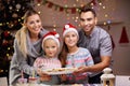 Happy family preparing Christmas biscuits Royalty Free Stock Photo