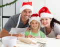 Happy family preparing Christmas cookies Royalty Free Stock Photo