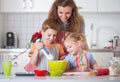 Happy family preparing cookies for Christmas eve Royalty Free Stock Photo