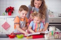 Happy family preparing cookies for Christmas eve Royalty Free Stock Photo