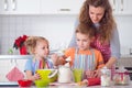 Happy family preparing cookies for Christmas eve Royalty Free Stock Photo