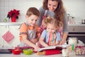 Happy family preparing cookies for Christmas eve Royalty Free Stock Photo